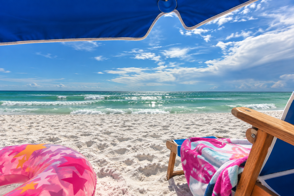 Beach chair, umbrella and float on the sand in Fort Walton Beach, Florida